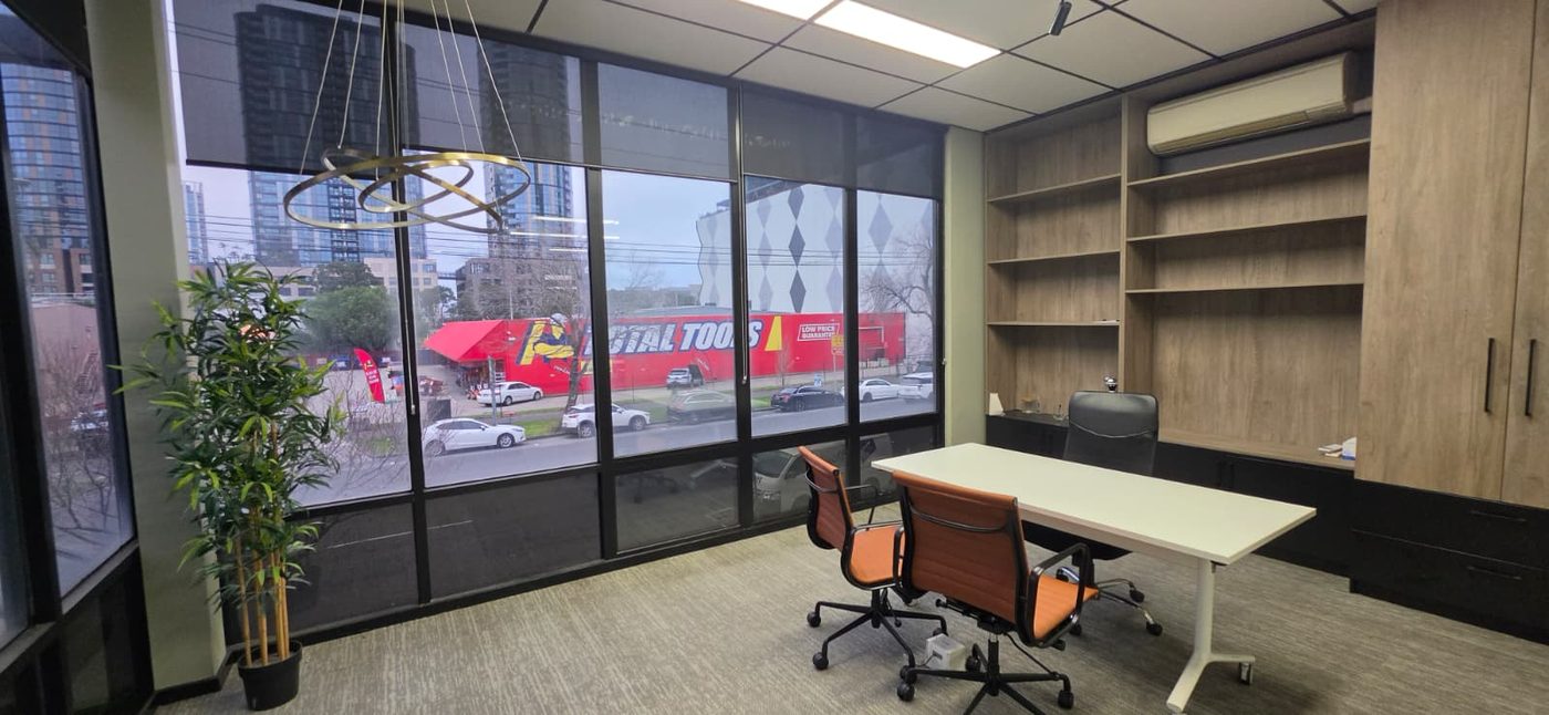 Southbank private office with city view, desk and built-in shelving